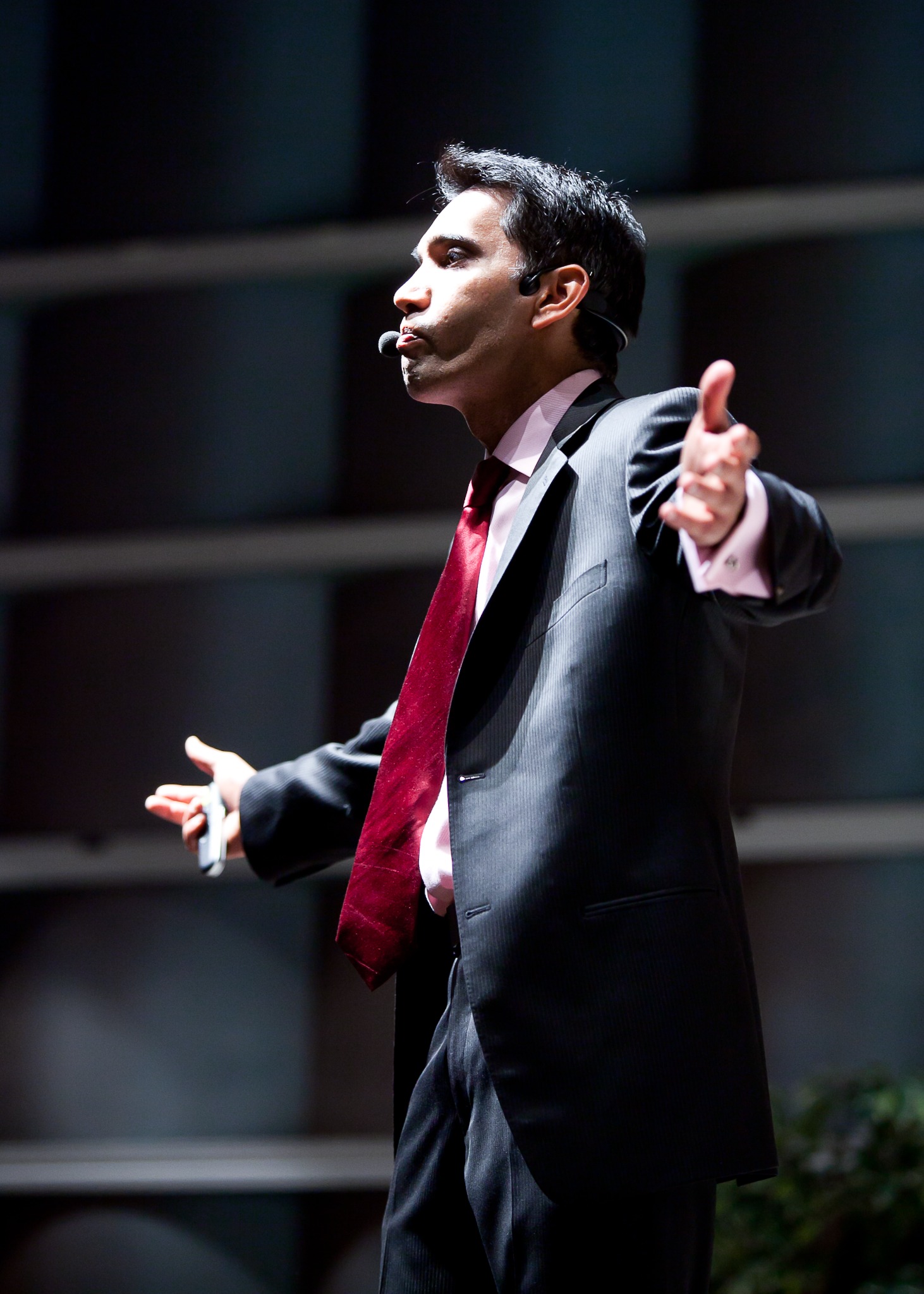 Srini Saripalli speaking on stage