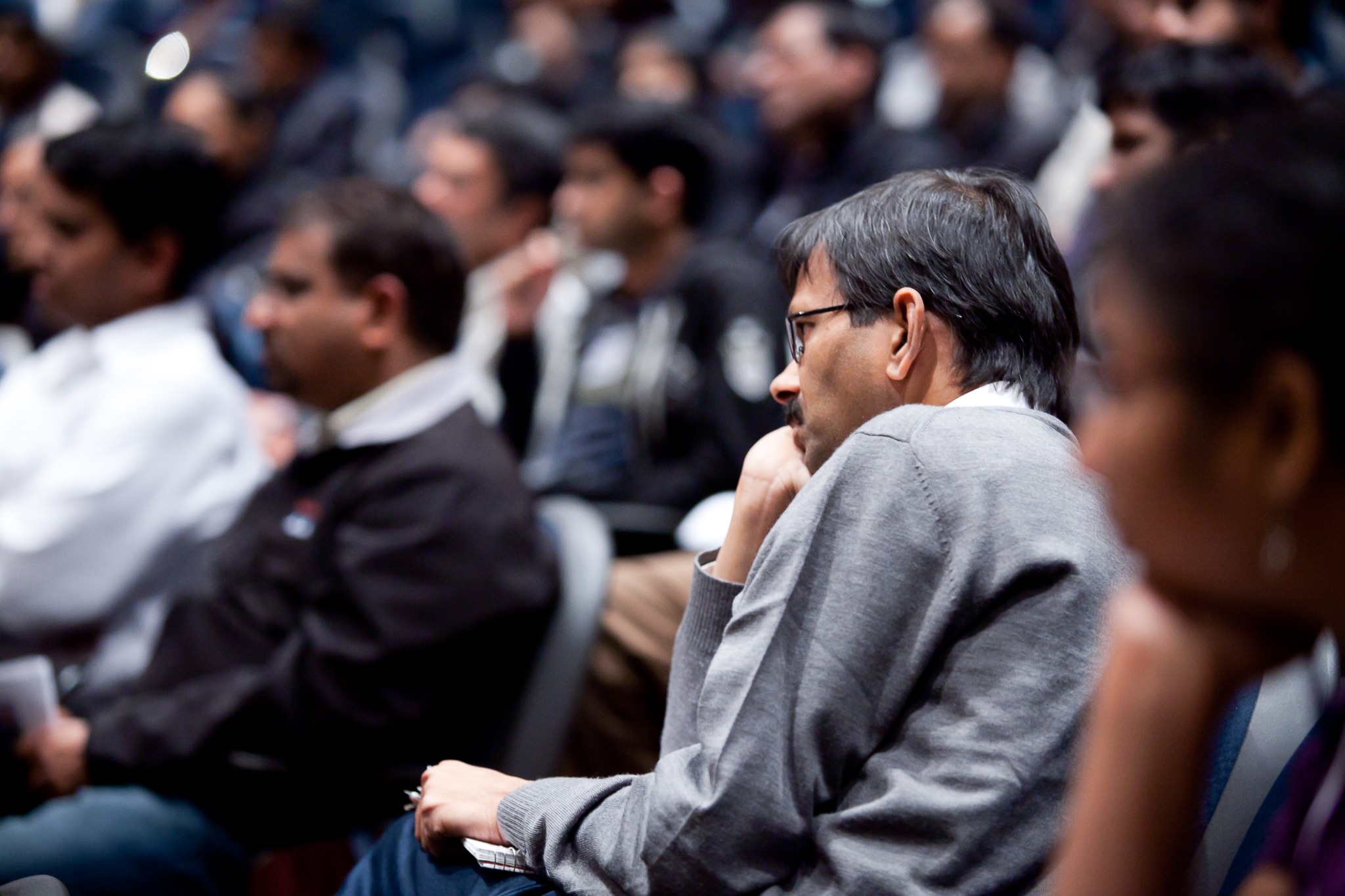 Audience member listening during Srini Saripalli's workshop